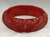 BB485 transparent red leaf carved bakelite bangle